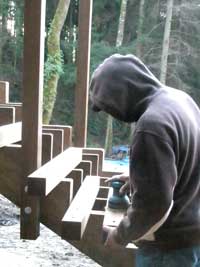 Eddie Moran sanding an ipe post
